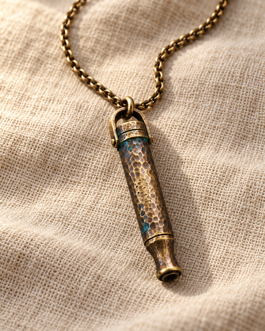 Close-up of the hammered texture on the brass-tone Zen Anchor pendant